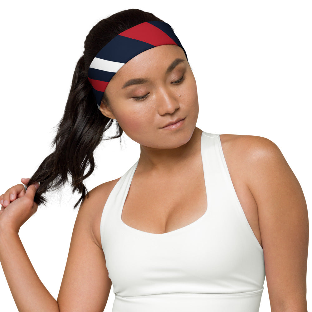 A model wearing the FOX News headband in a bright, clean, outdoor setting reflecting active American lifestyle apparel.