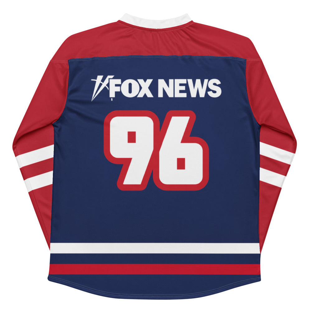 Close-up of the FOX News logo on the front of a premium hockey jersey with athletic stitching.