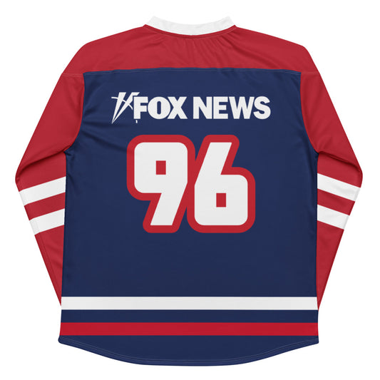 Close-up of the FOX News logo on the front of a premium hockey jersey with athletic stitching.