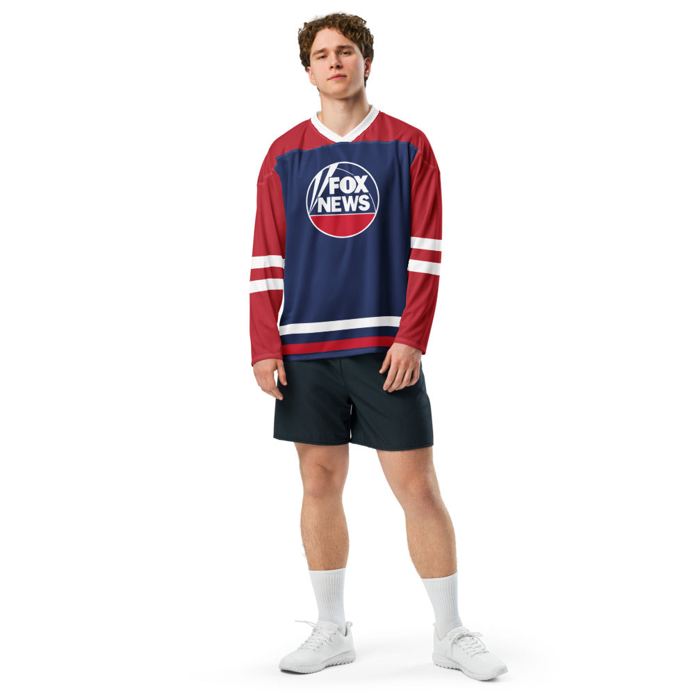 A male viewer wearing the FOX News jersey in a clean, suburban backyard morning coffee setting.