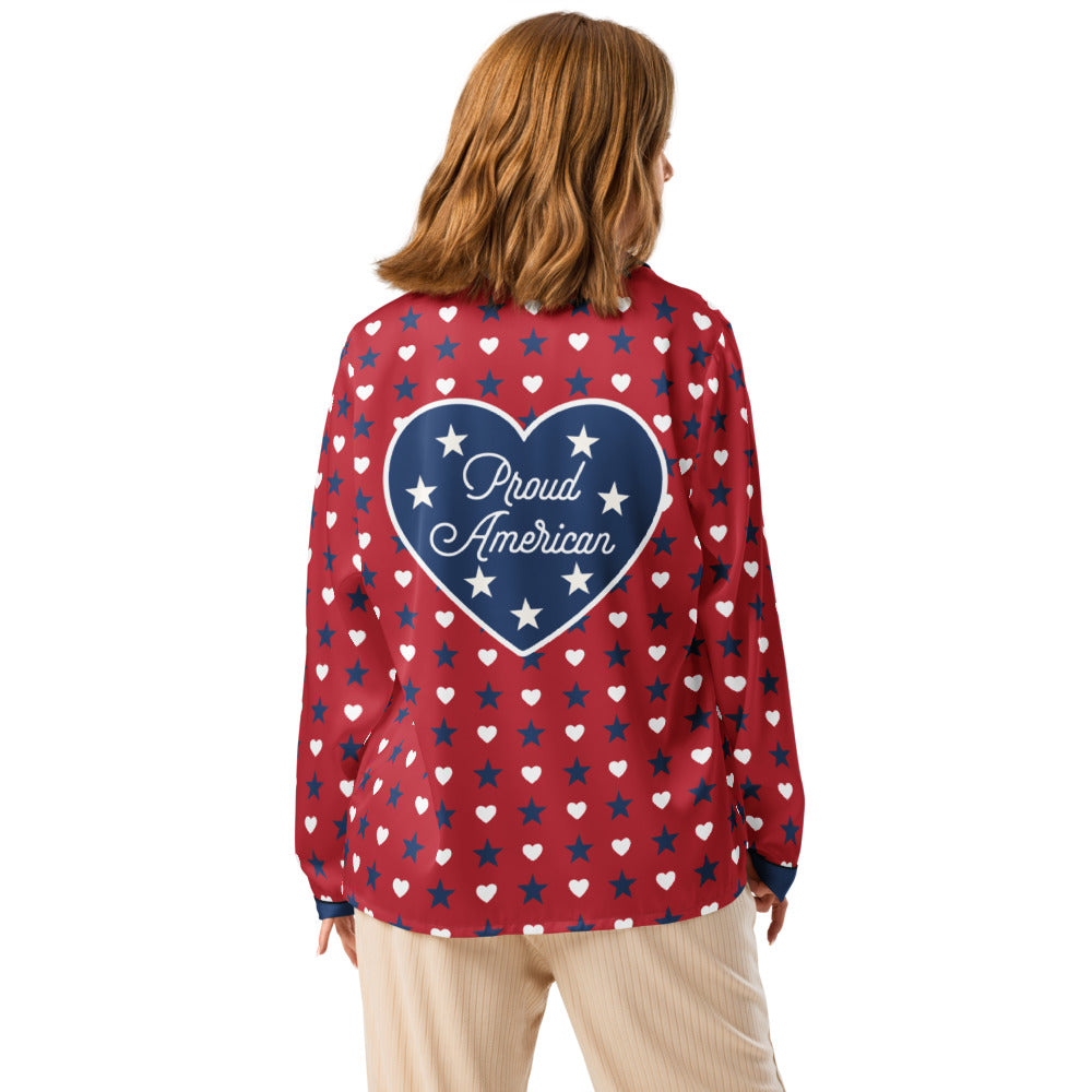 An outdoor morning coffee setting on a suburban porch with the FOX News pajama top displayed on a wooden accent chair.