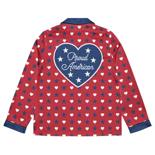 A cozy American living room setting featuring the FOX News Proud American Hearts And Stars Women Long Sleeve Pajama Top neatly folded on a comfortable armchair.