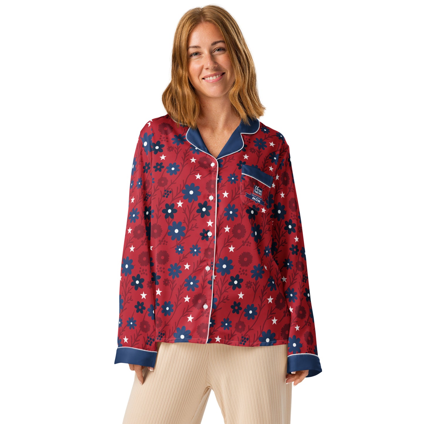 A woman wearing the patriotic *FOX News* pajama top in a comfortable, suburban American living room setting.