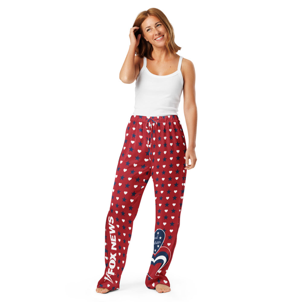 A cozy backyard morning coffee setting showcasing the FOX News pajama pants laid out on a chair.