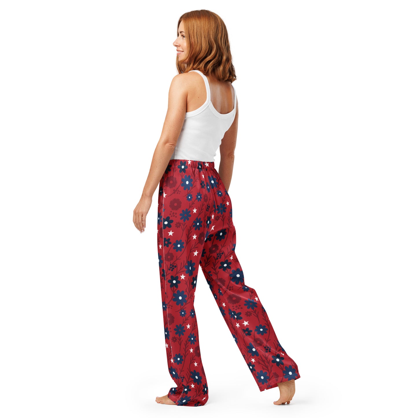 A patriotic morning setting featuring a woman in Proud American Mom pajamas holding a coffee mug in a clean, modern kitchen.