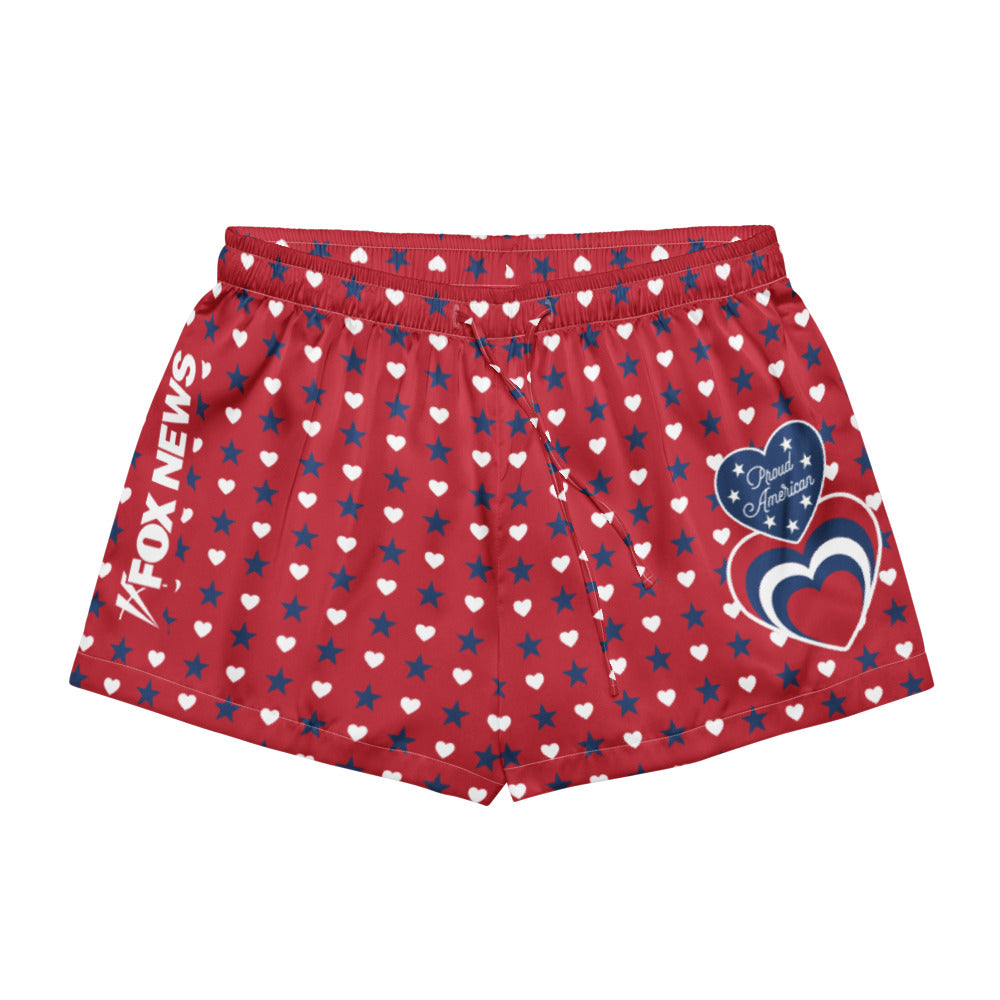A comfortable American living room setting featuring the FOX News Proud American Women's Pajama Shorts laid out neatly.