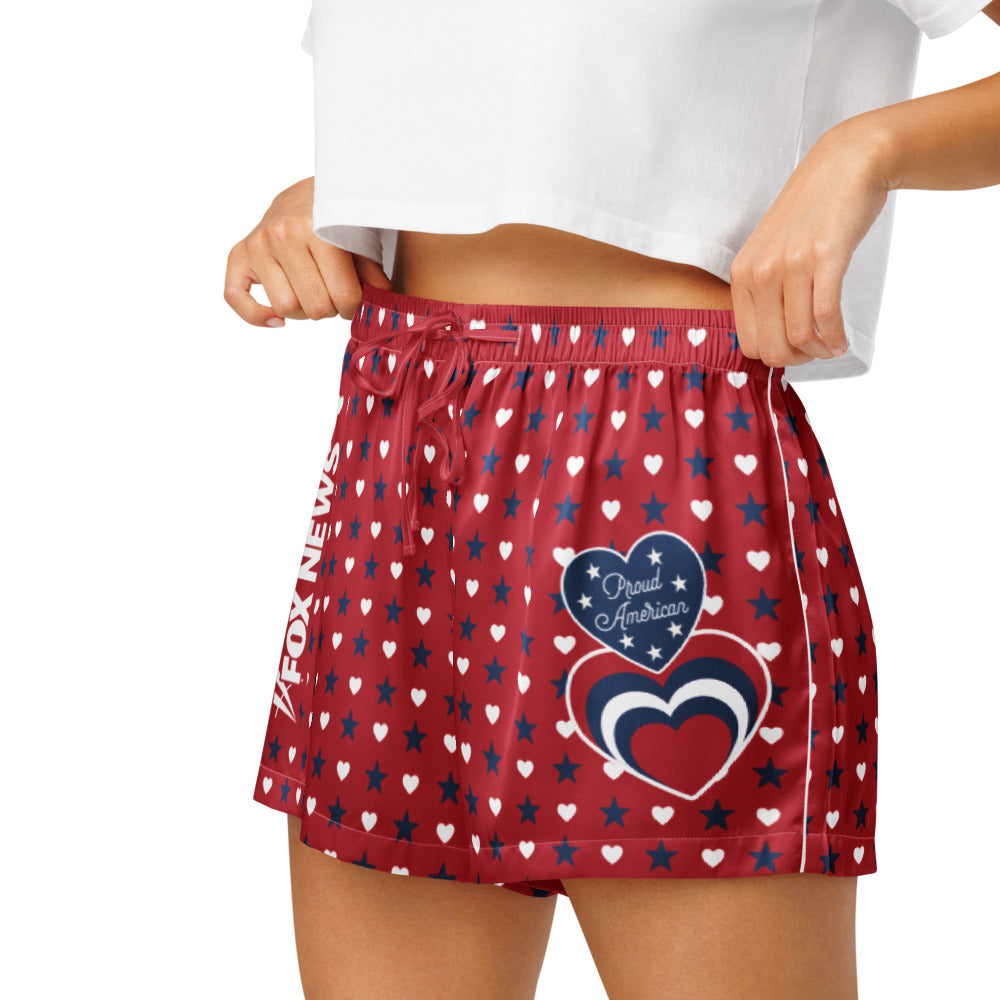 A lifestyle shot highlighting the soft fabric and comfortable waistband of the FOX News lounge shorts in a bright, modern bedroom.