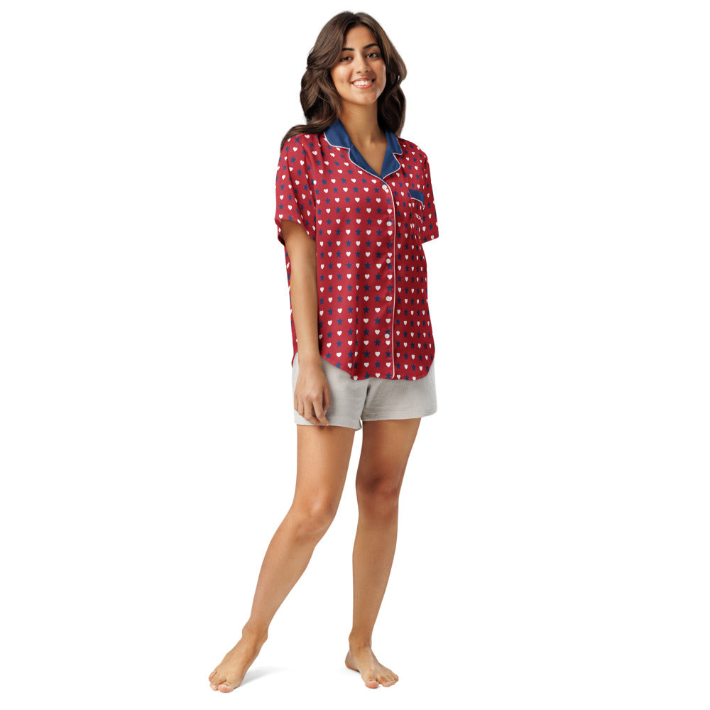 A cozy backyard morning coffee setting featuring the FOX News women's pajama top neatly displayed on patio seating.