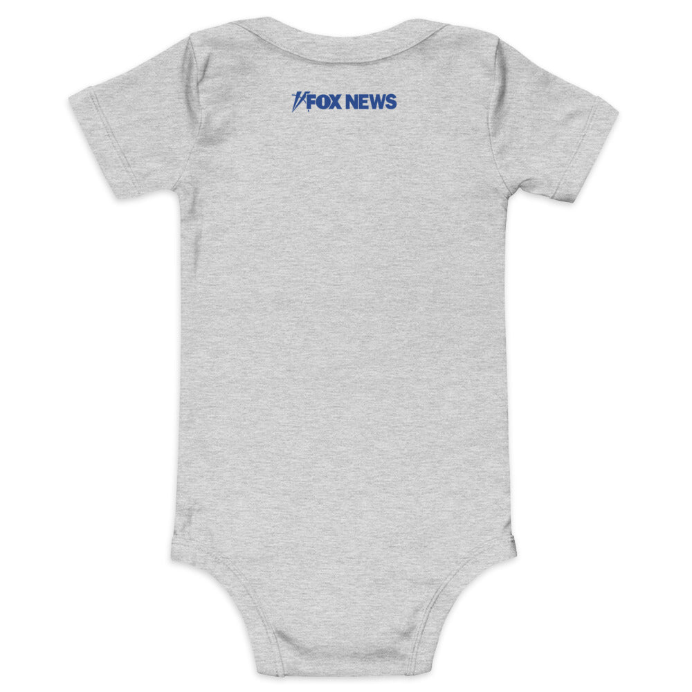 Close-up of the FOX News logo and Proud Little American graphic on a soft white baby bodysuit.