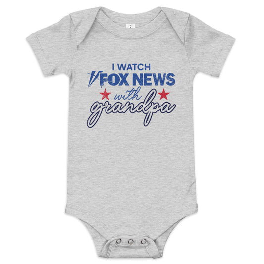 A soft white baby bodysuit featuring the text I Watch with Grandpa and the iconic FOX News logo in a clean American home setting.