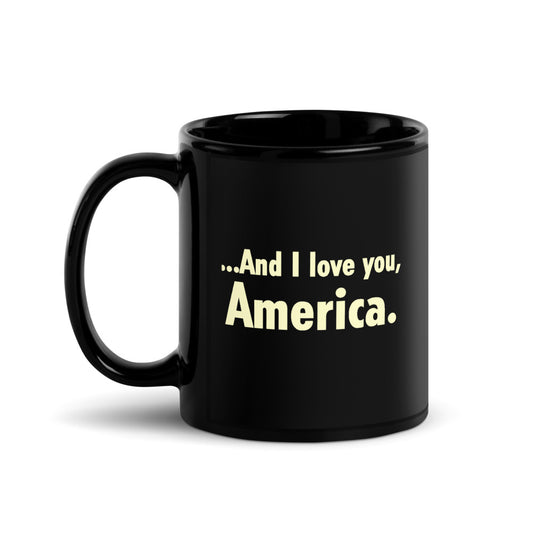 A bold Gutfeld! And I love you, America black mug sitting on a clean granite countertop in a modern American kitchen.