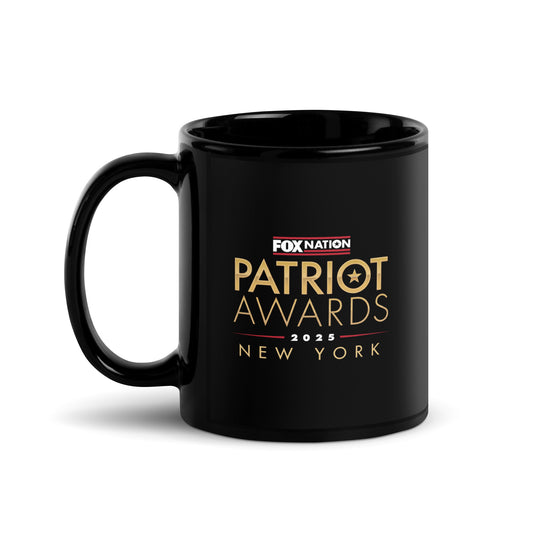 A black glossy *FOX Nation* Patriot Awards 2025 personalized mug sitting on a clean kitchen counter in a modern American home.