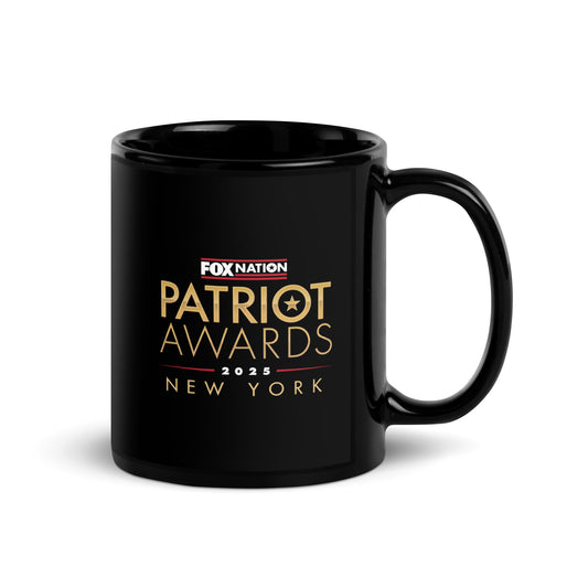 Close up of the official *Patriot Awards 2025* branding and personalized text on the side of a black ceramic mug.