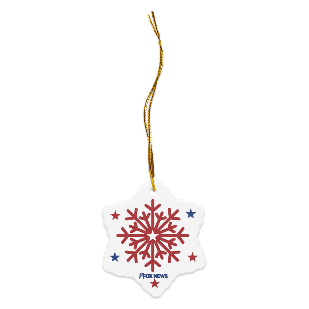 A FOX News holiday ornament hanging on a Christmas tree in a clean, brightly lit American home setting.
