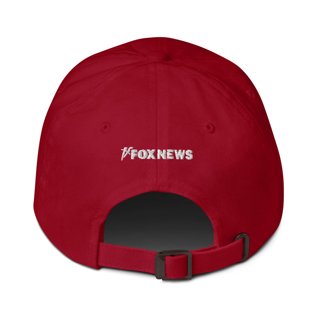 A loyal viewer wearing the official FOX News cap while relaxing on a sunny patio.