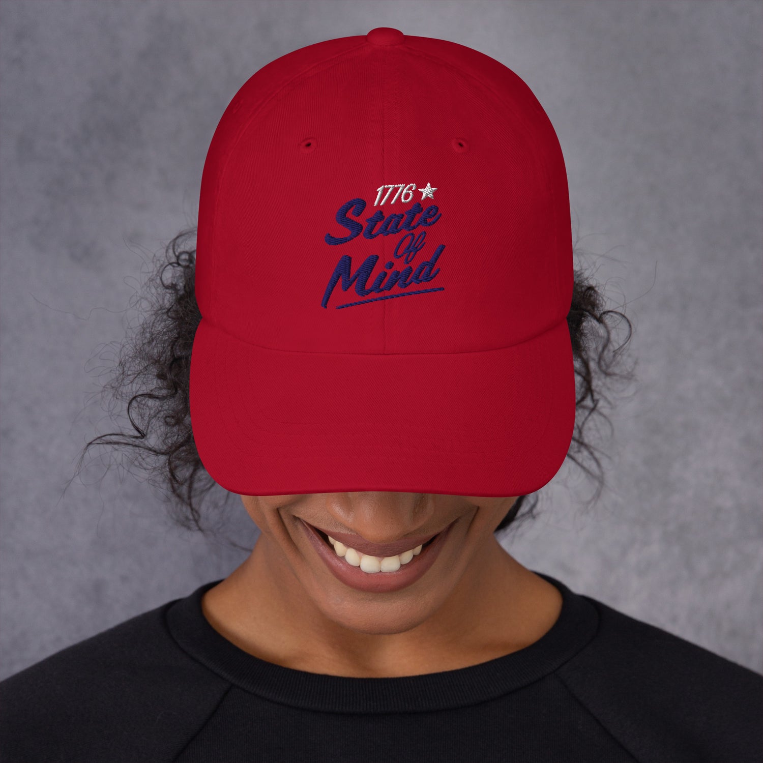 An angled view showcasing the curved brim and high-quality stitching of the navy, red, and white color variants.