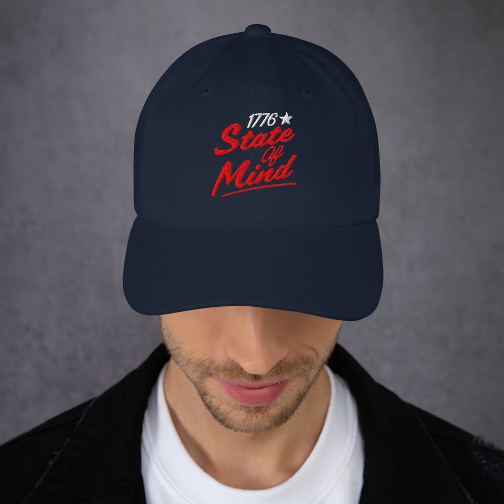A clean lifestyle product shot of the dad hat placed neatly on a rustic wooden table.