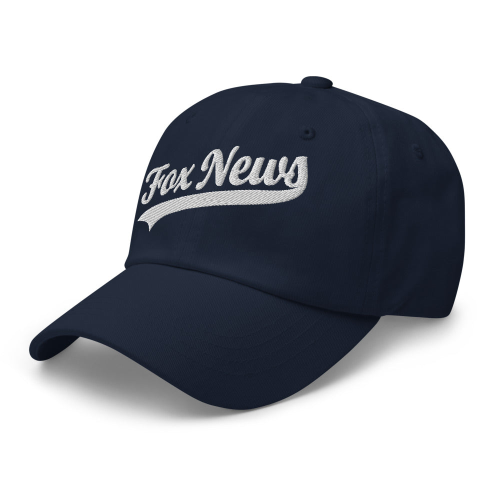 Close-up detail shot of the embroidered FOX News sports logo on the front of the dark navy dad hat.