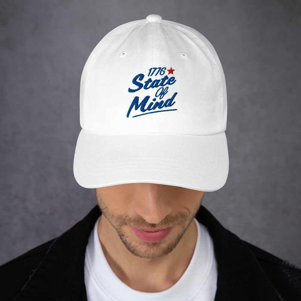 A detailed view of the adjustable strap closure at the back of the embroidered hat.