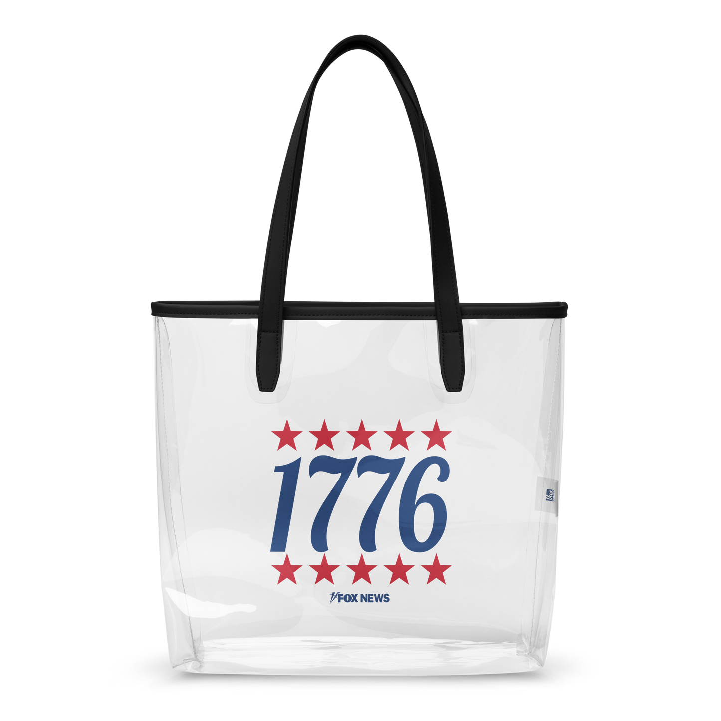 A FOX News 1776 Clear Tote Bag sitting on a wooden table in a sunlit, suburban American home.