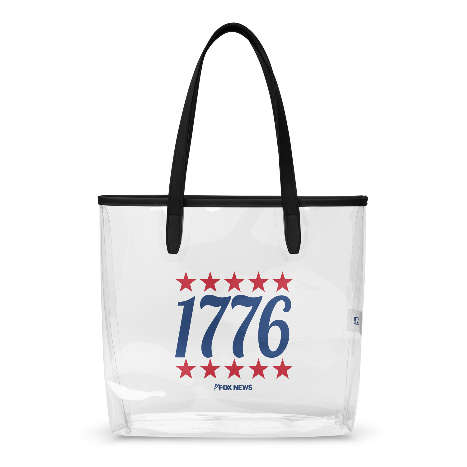 A FOX News 1776 Clear Tote Bag sitting on a wooden table in a sunlit, suburban American home.