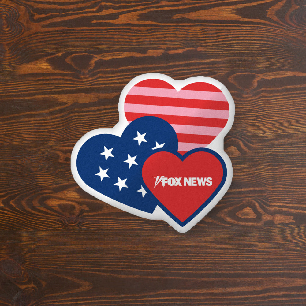 Detailed view of the crisp *FOX News* logo and heart graphics on a high-quality white throw pillow.