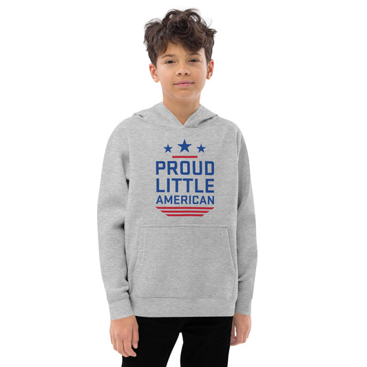 A young child wearing the *FOX News* Proud Little American kids hoodie in a clean, sunny American backyard.-2