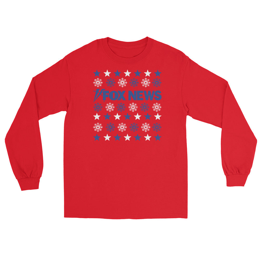 A person wearing the red *FOX News* Holiday Snowflakes Long Sleeve Shirt in a cozy American living room during the Christmas season.