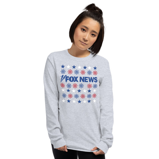 A person wearing the red *FOX News* Holiday Snowflakes Long Sleeve Shirt in a cozy American living room during the Christmas season.-2