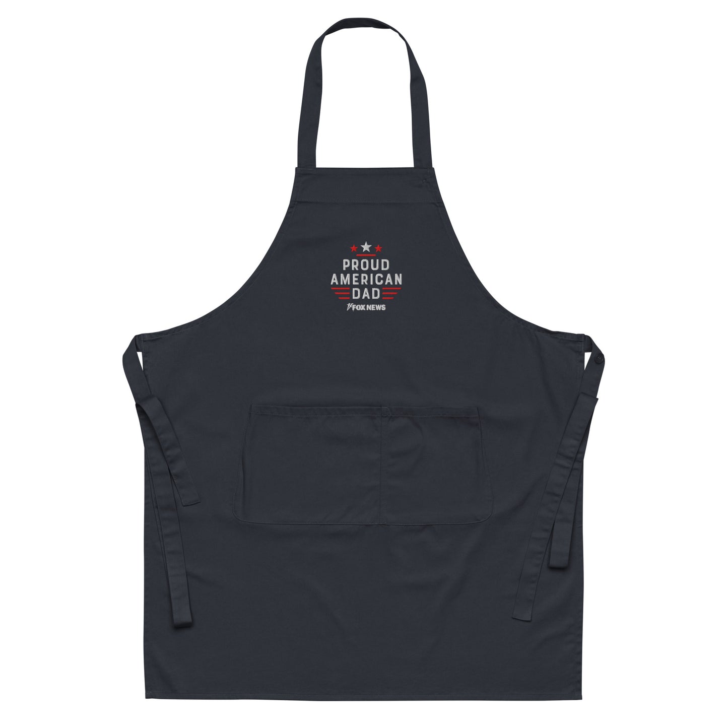 A proud American dad wearing the FOX News Proud American Dad Embroidered Apron in a modern suburban kitchen