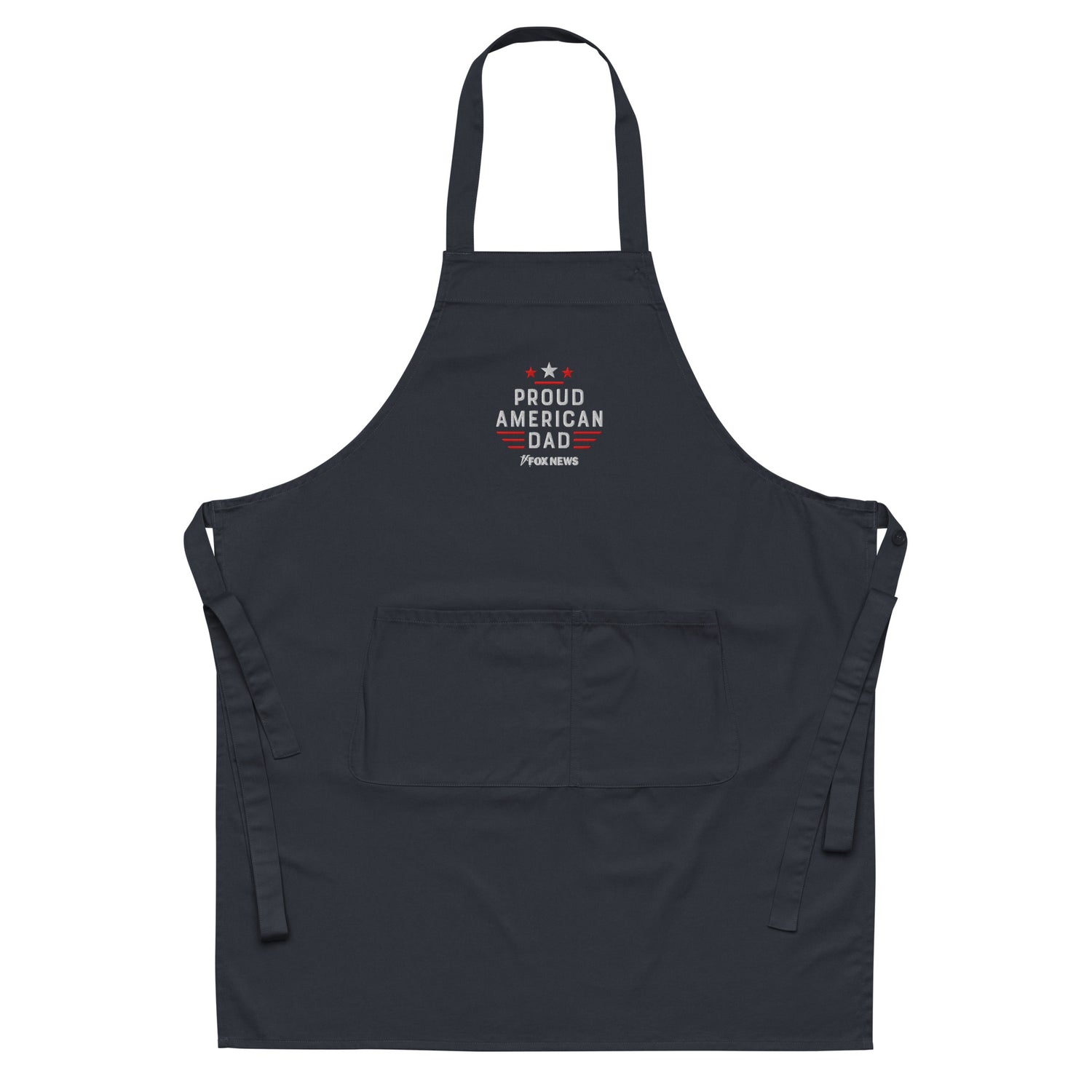 A proud American dad wearing the FOX News Proud American Dad Embroidered Apron in a modern suburban kitchen