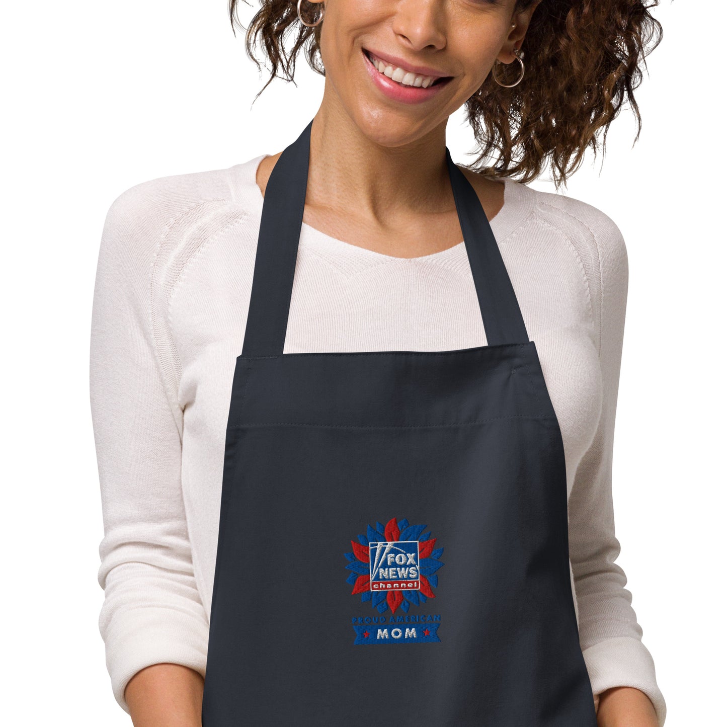 Detailed product view of the adjustable neck strap and waist ties on the FOX News apron.