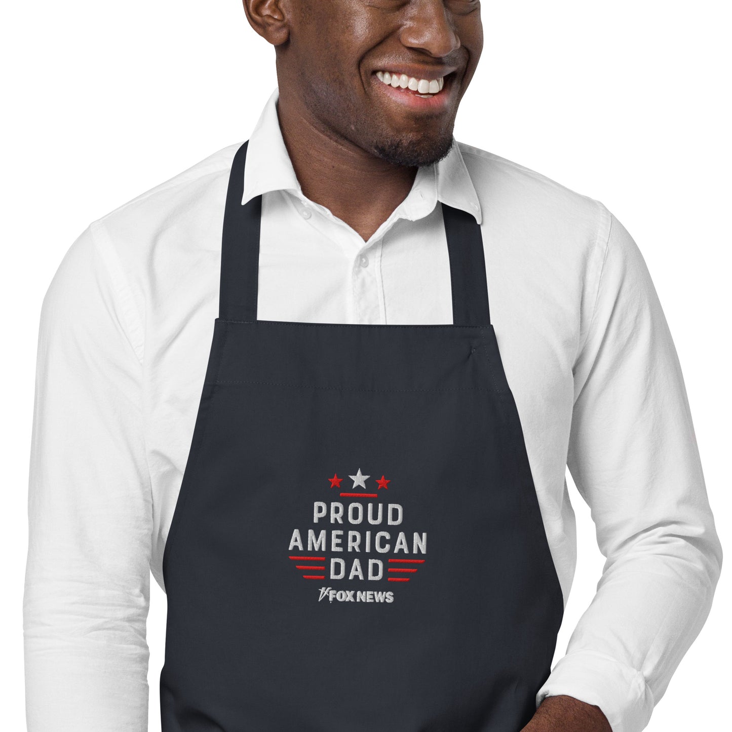 A patriotic dad grilling outdoors while wearing the FOX News embroidered apron