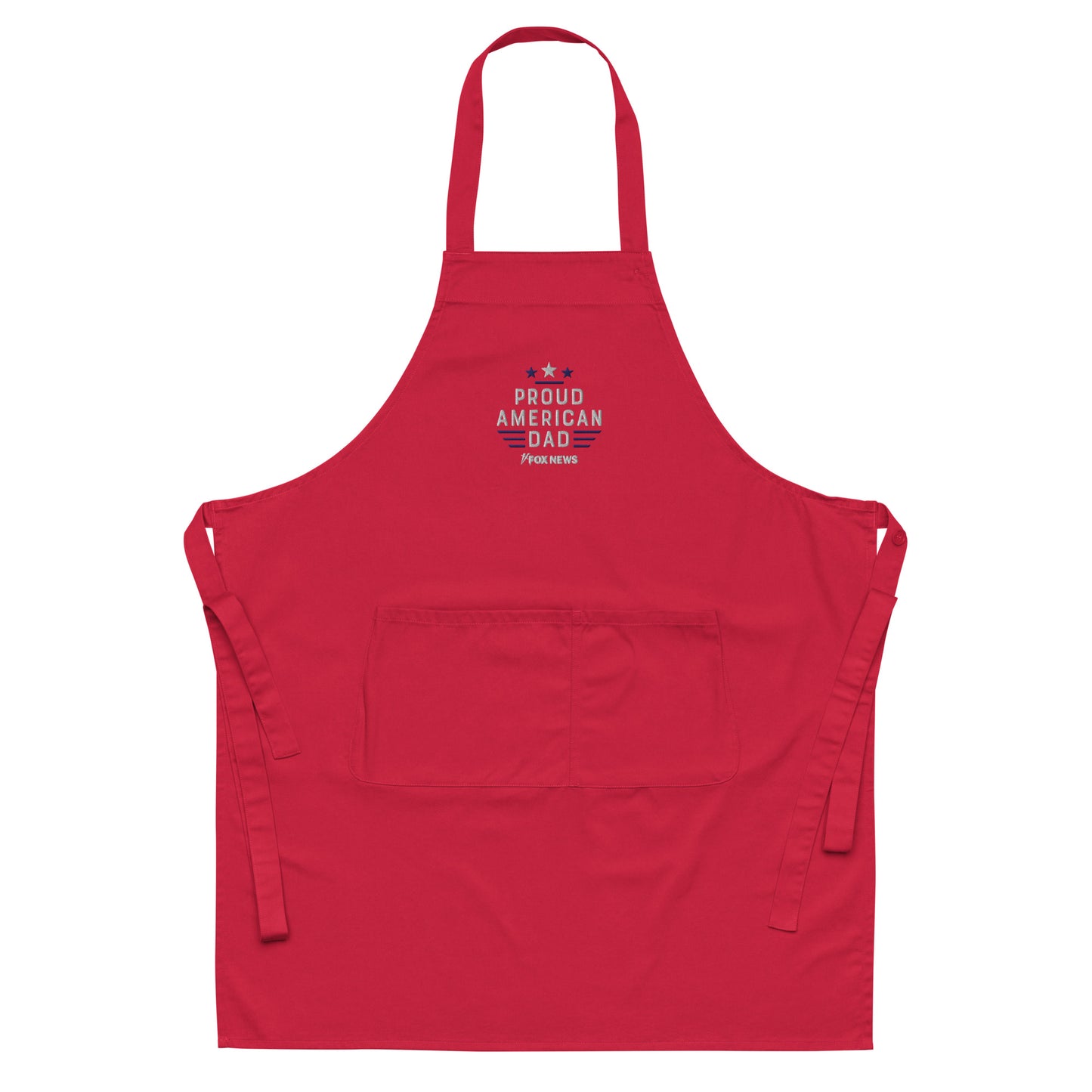 The FOX News Proud American Dad Embroidered Apron neatly hung in a clean, traditional American kitchen setting