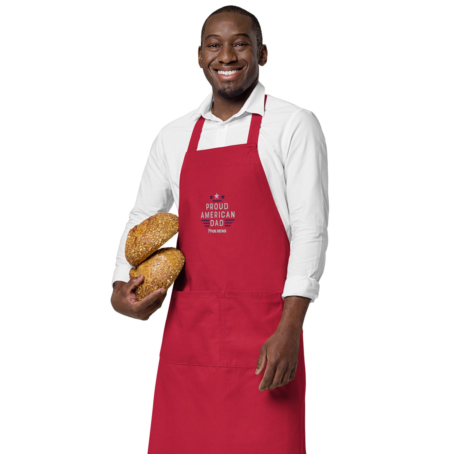 Side angle view of the embroidered apron showing adjustable straps and secure fit