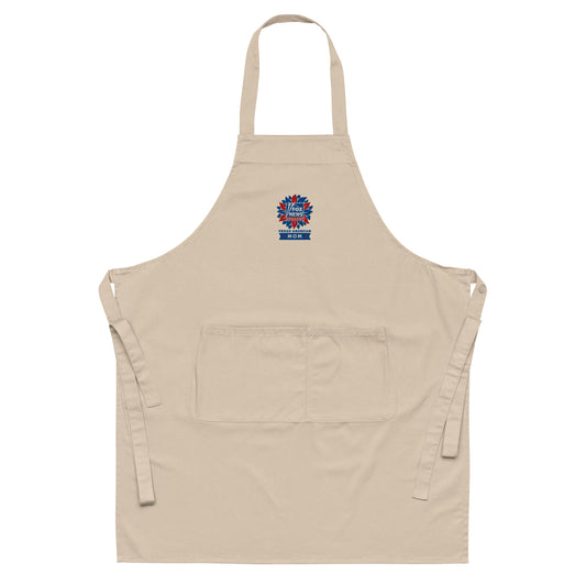 Close-up shot of the crisp embroidered Proud American Mom logo on the navy apron fabric.