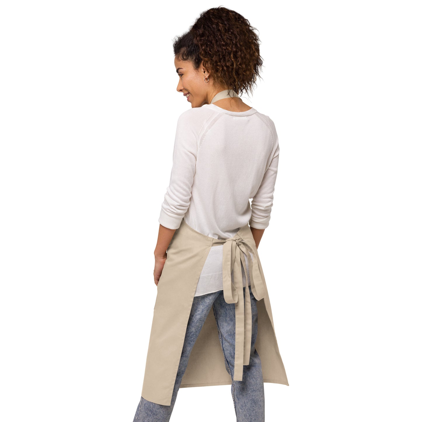 A warm, inviting suburban kitchen background highlighting the durable cotton blend texture of the apron.