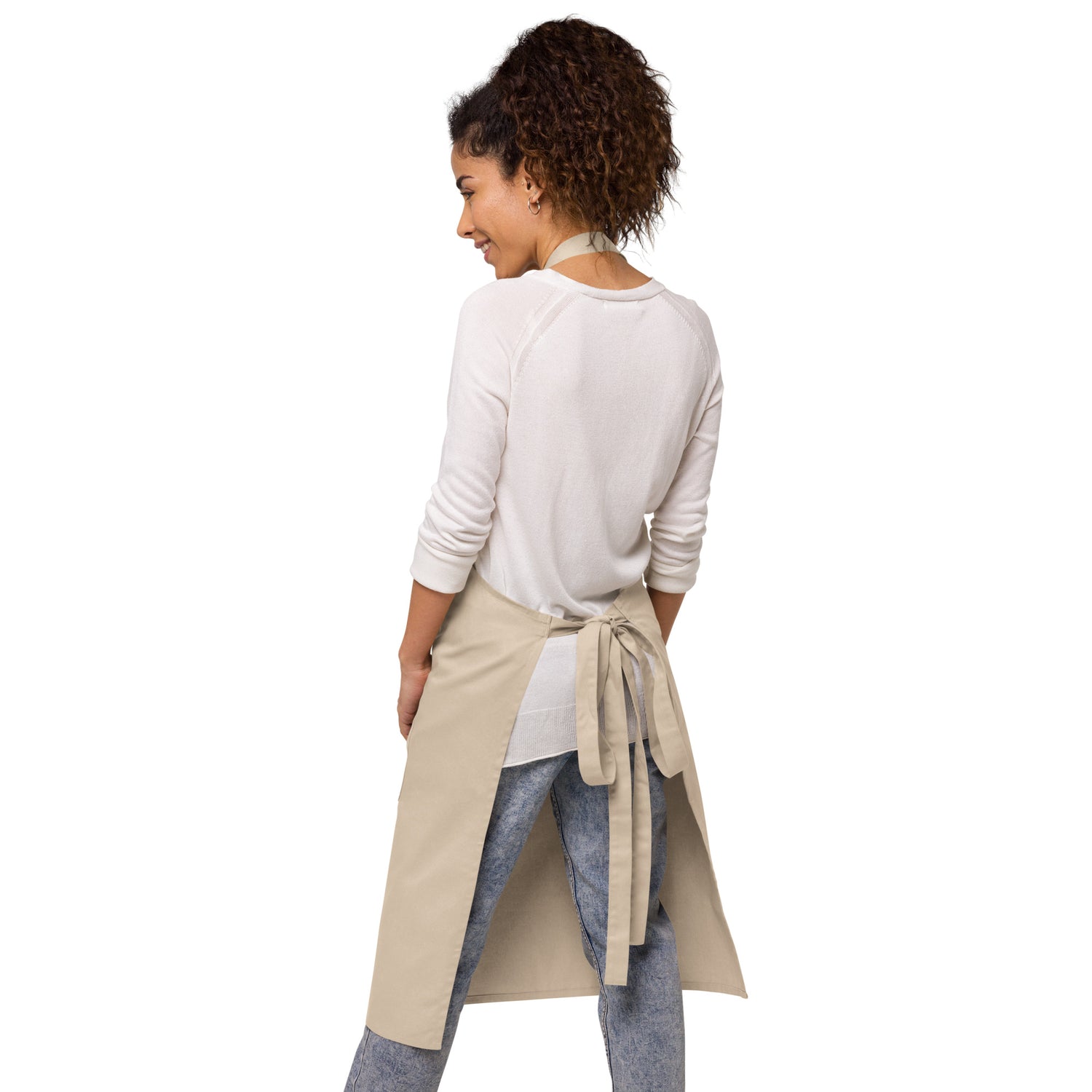 A warm, inviting suburban kitchen background highlighting the durable cotton blend texture of the apron.