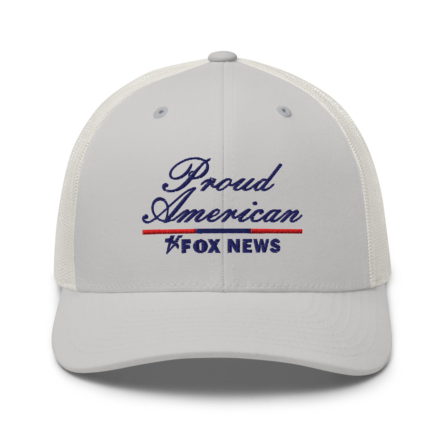 A Navy FOX News Proud American Trucker Hat resting on a clean wooden table in a brightly lit American living room.