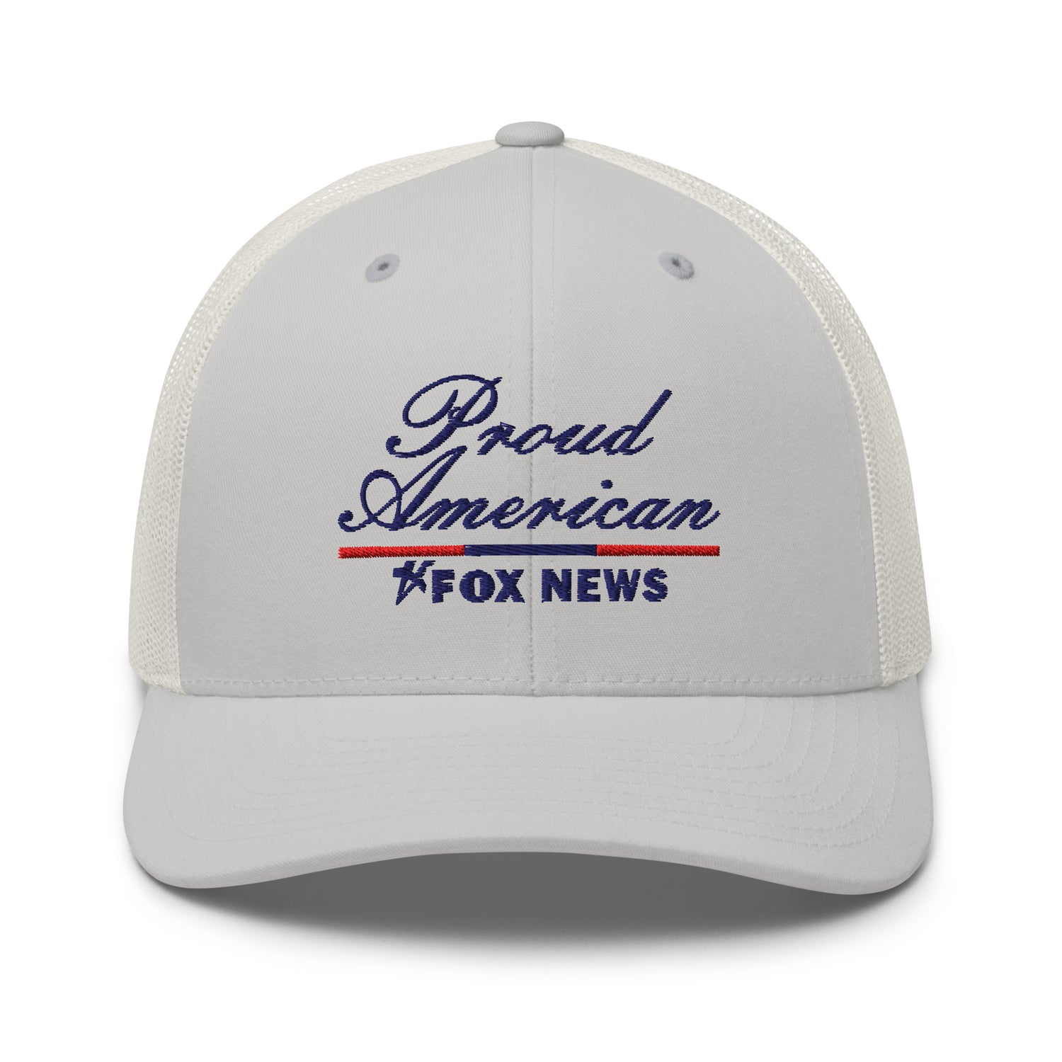 A Navy FOX News Proud American Trucker Hat resting on a clean wooden table in a brightly lit American living room.