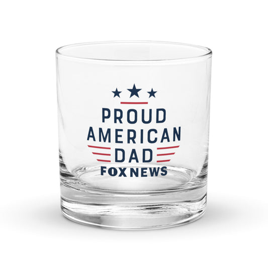 A close-up of the 10.5 oz FOX News rocks glass filled with whiskey and ice, showing the high-quality print detail.