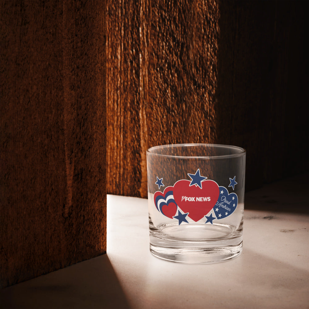 The FOX News Proud American rocks glass styled in a modern kitchen setting, reflecting the patriotic values of the brand.