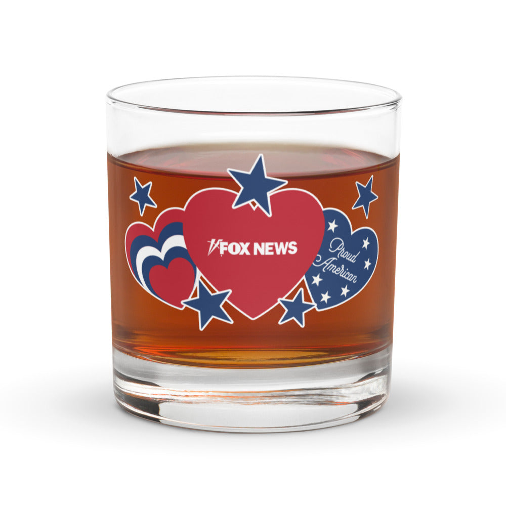 Side view of the FOX News rocks glass showcasing the clear glass construction and bold red and blue design.