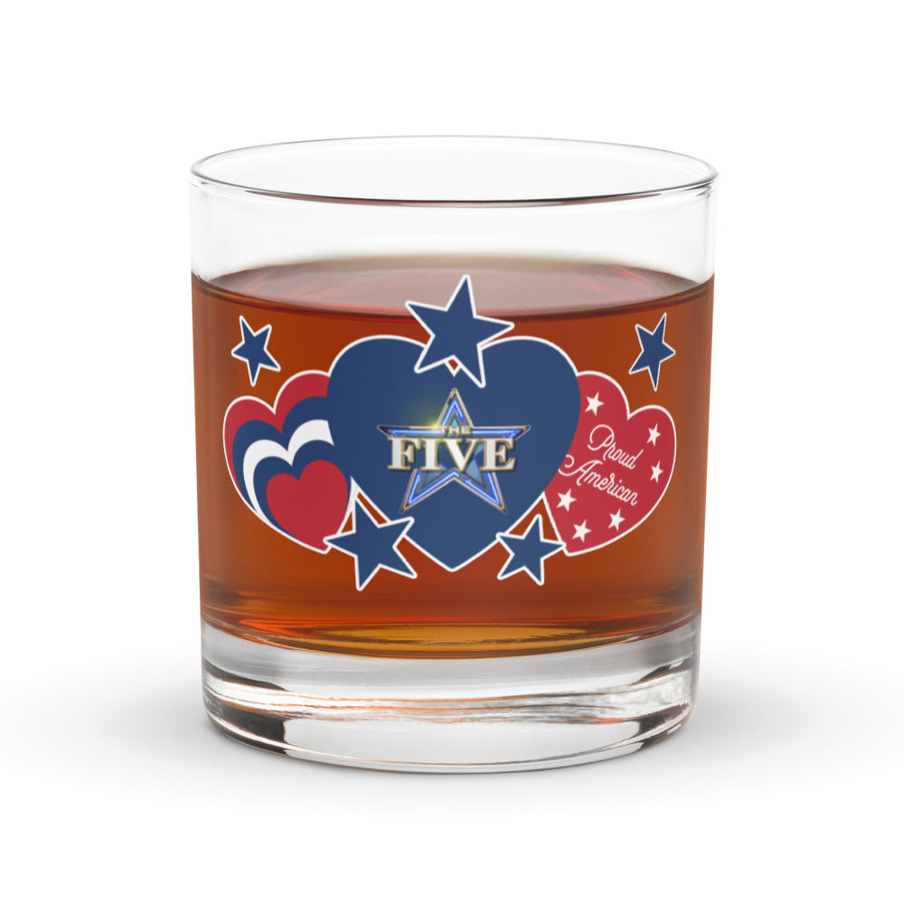 The Five rocks glass in a comfortable American living room setting, showcasing the Proud American collection branding.