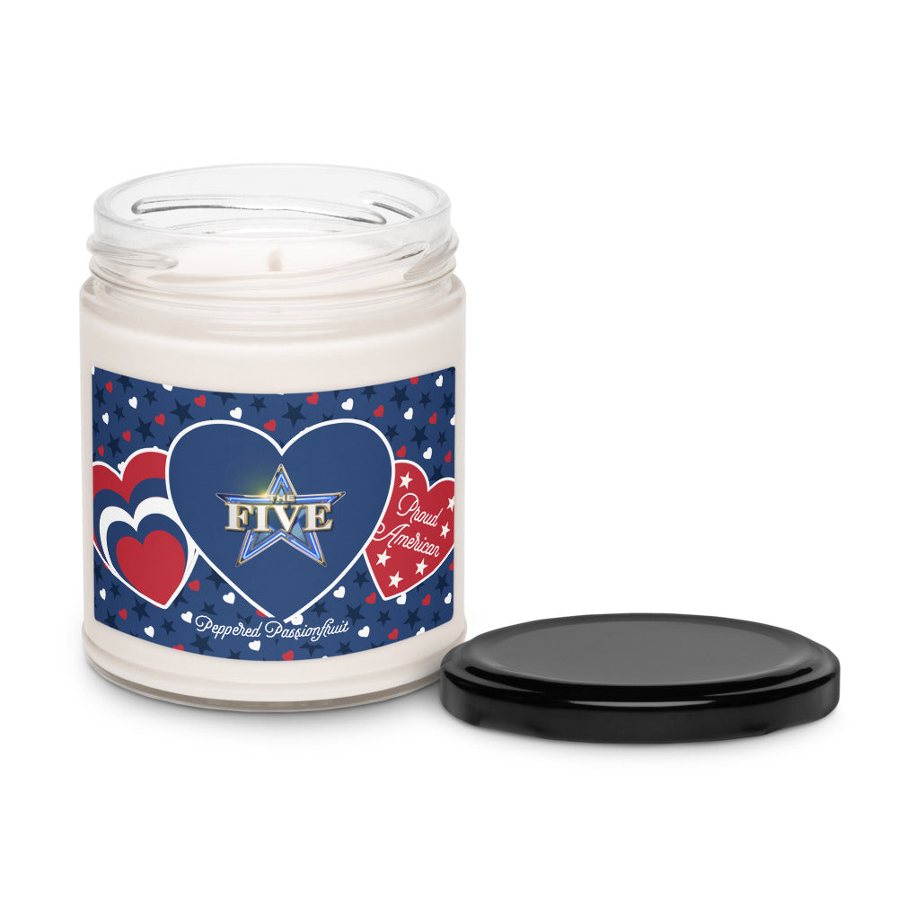 A 9oz scented candle with a white label showing the FOX News The Five logo and a hearts and stars pattern.