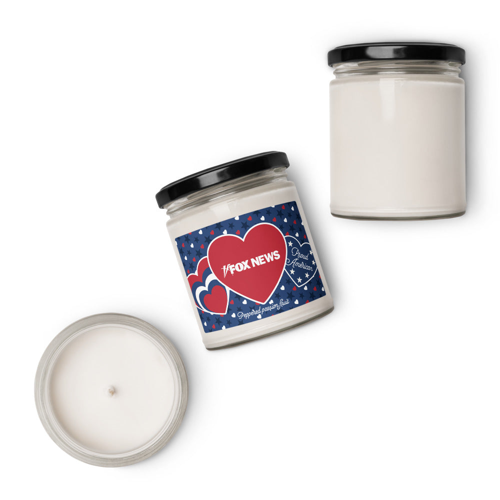 The Proud American Hearts and Stars candle placed on a clean wooden table in a comfortable American living room setting.