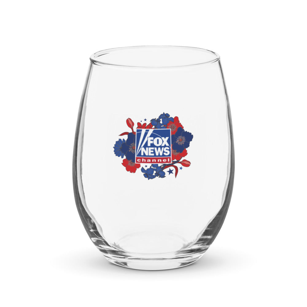 Close-up shot of the FOX News Proud American Mom stemless wine glass resting on a clean wooden tabletop in a bright suburban home setting.