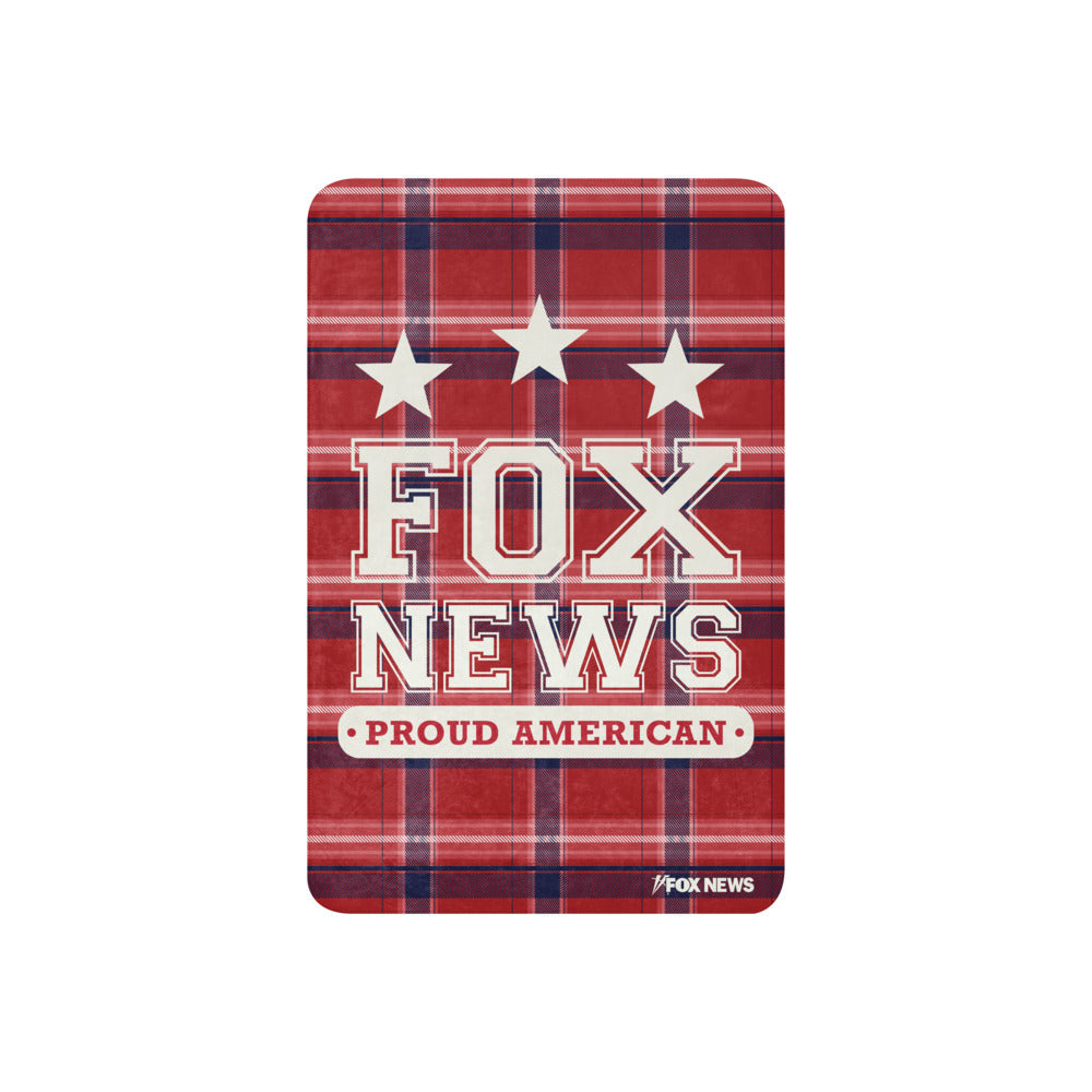 The *FOX News* Proud American Blanket folded neatly in an American home office setting.