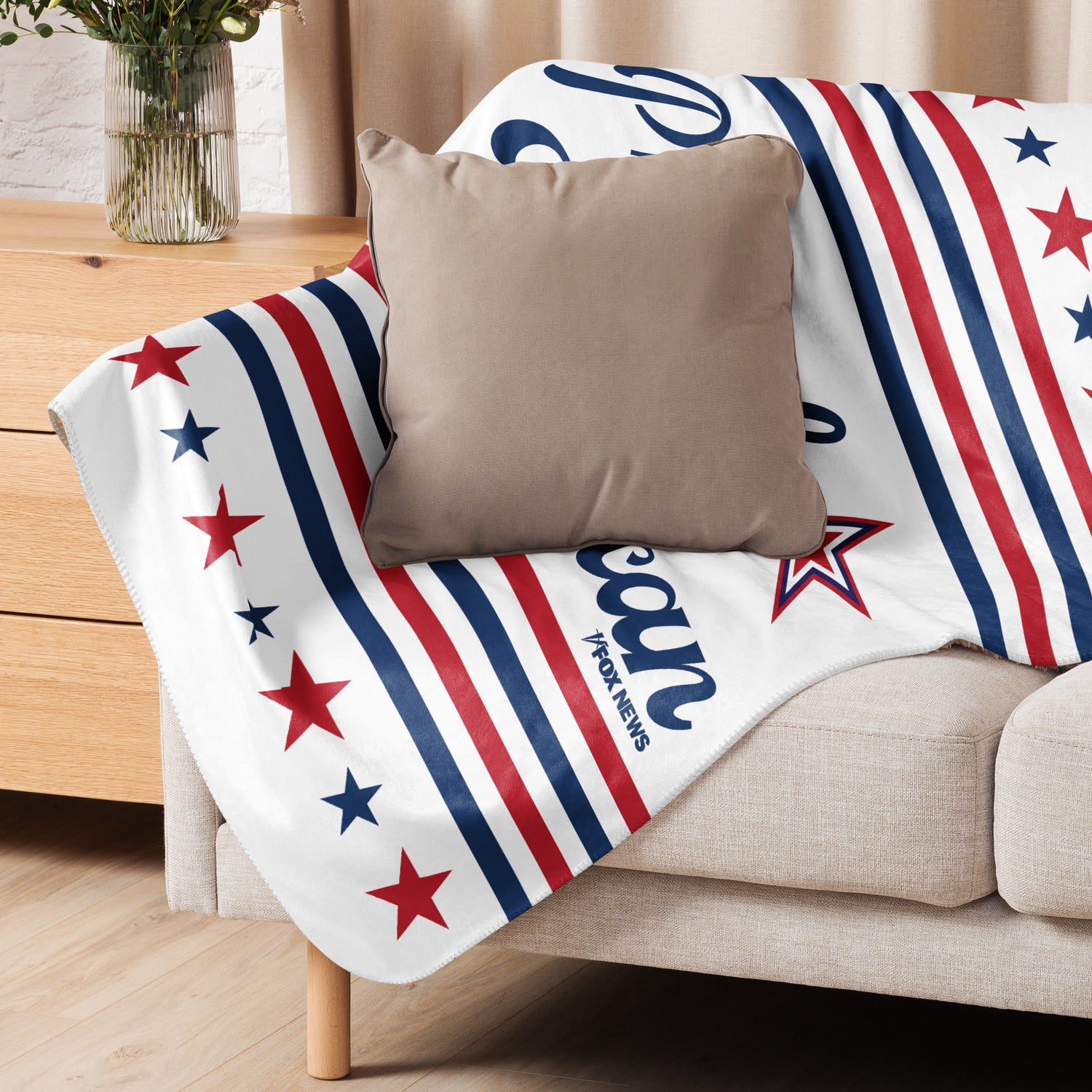 A comfortable family room setting highlighting the soft texture and inviting warmth of the FOX News blanket.