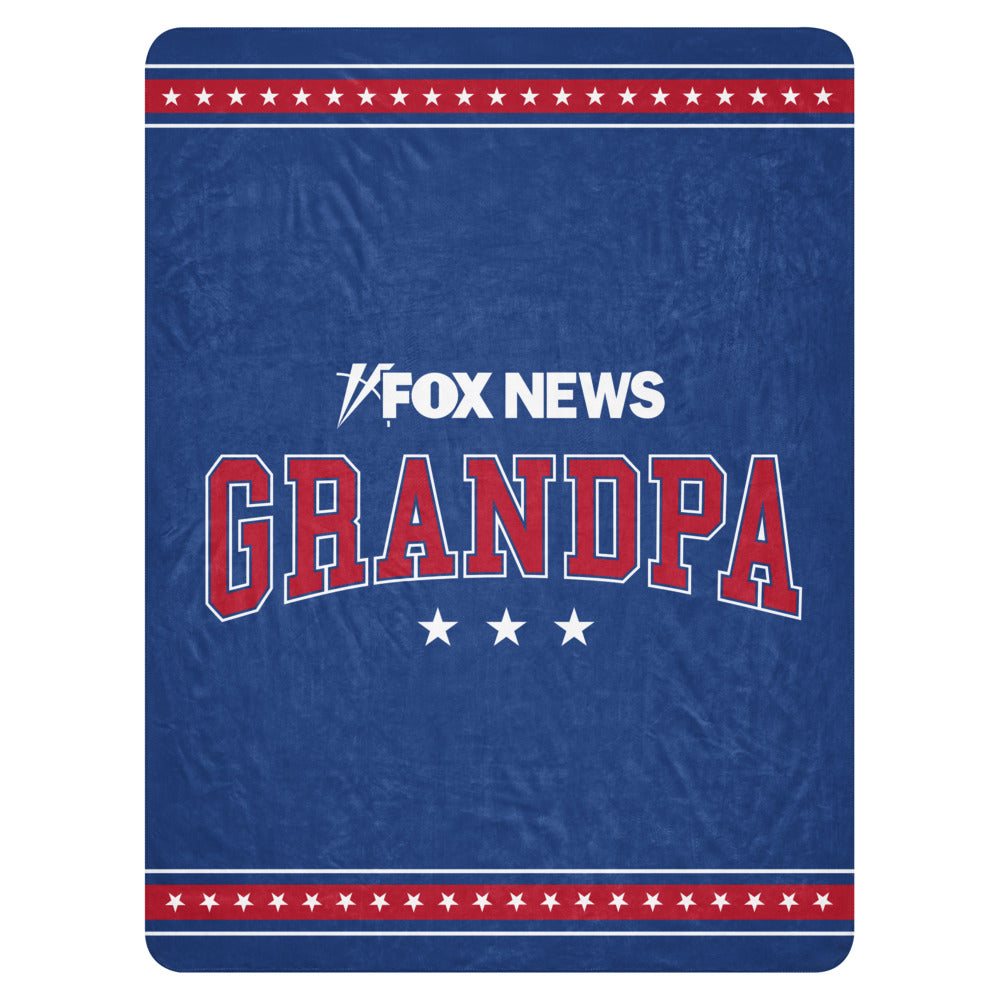 A premium FOX News Grandpa Sherpa Blanket draped neatly over a sofa in a bright, modern American home.
